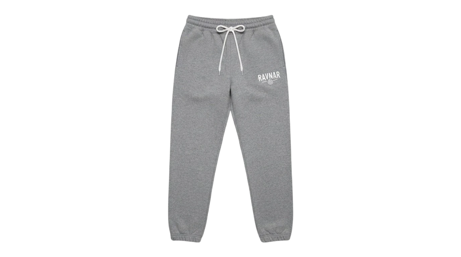 Ravnar grey heavyweight sweatpants with a white drawstring and logo detail on a neutral concrete background
