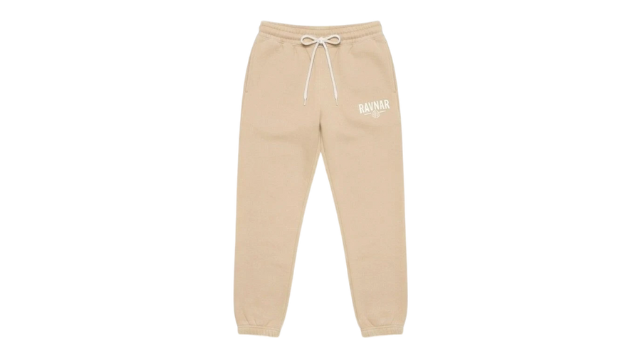 Ravnar beige heavyweight sweatpants with a drawstring waist and white logo embroidery on a grey background