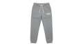 Ravnar grey heavyweight sweatpants with a white drawstring and logo detail on a neutral concrete background
