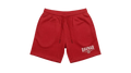 Ravnar red heavyweight cotton shorts with a relaxed fit, drawstring waist, and white logo print on the leg.