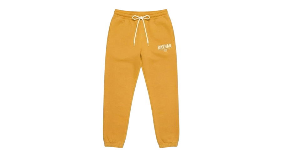 Ravnar heavyweight yellow sweatpants with a drawstring waist and white logo embroidery on a grey background